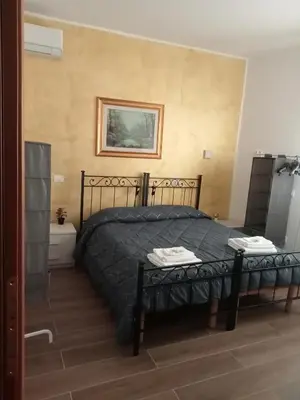 Letto o letti in una camera di B&B Vittorio