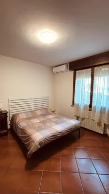Letto o letti in una camera di Villa Marisa