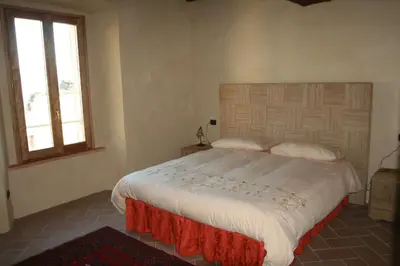 Letto o letti in una camera di SacreTerre B&B e Agriturismo