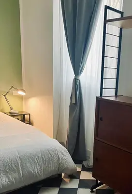 Letto o letti in una camera di La foresteria dell'Abate - Reggio Emilia centro storico