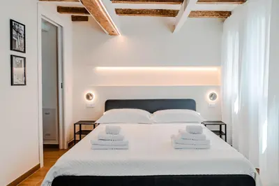 Letto o letti in una camera di I leoni - Downtown room camera in centro a Reggio Emilia