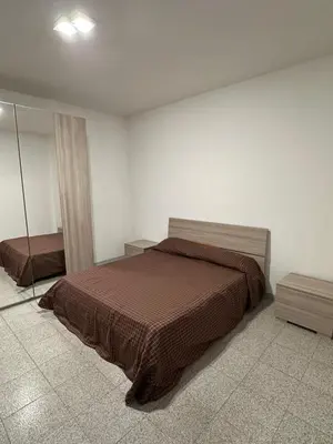 Letto o letti in una camera di La Reggia Apartment