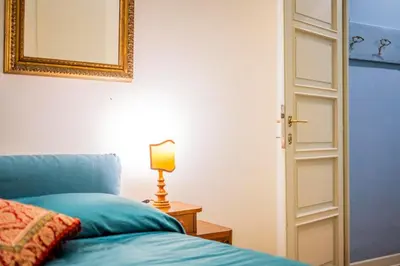 Letto o letti in una camera di B&B San Giovanni Parma