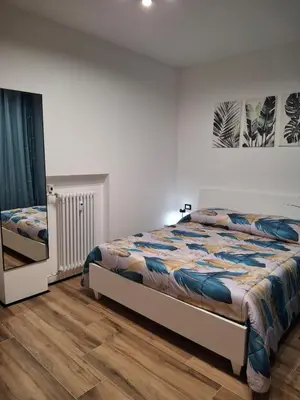Letto o letti in una camera di RELAIS SUITE Modena Parc