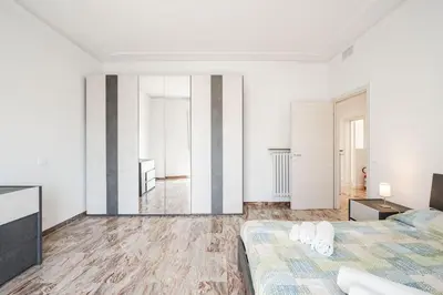 Letto o letti in una camera di IZZ1 Apartments Plus - Motor&Food Valley