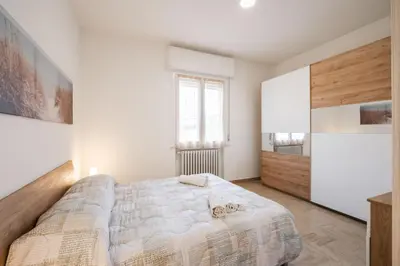 Letto o letti in una camera di IZZ1 Apartments Plus - Motor&Food Valley