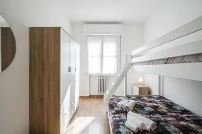 Letto o letti in una camera di IZZ1 Apartments Plus - Motor&Food Valley