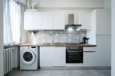 Cucina o angolo cottura di IZZ1 Apartments Plus - Motor&Food Valley