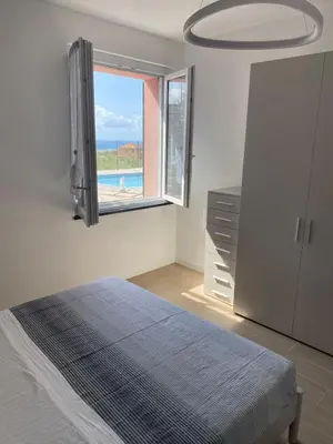Letto o letti in una camera di Villa-swimming pool Ca'Du'Ma' Portofino view est