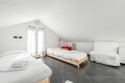 Letto o letti in una camera di Moneglia Villa in A Quiet Place - Happy Rentals