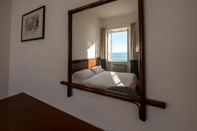 Letto o letti in una camera di 328 - Lord Nelson Chiavari, Appartamento Vista Mare 1