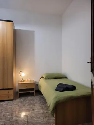 Letto o letti in una camera di La casa di Sergiò