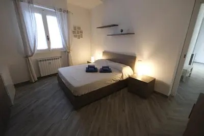 Letto o letti in una camera di Nora Home by PortofinoVacanze
