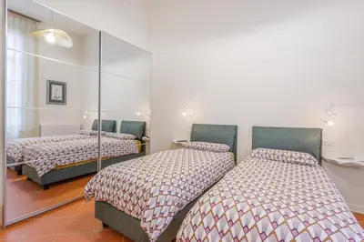 Letto o letti in una camera di Inner Garden Retreat near Ghirlandina