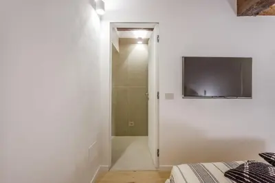 TV o dispositivi per l'intrattenimento presso Pietra di Piazza Grande - Rua Frati 34 Palace by MoVeBNB