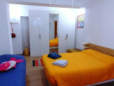 Letto o letti in una camera di B&B La Tana del Bianconiglio