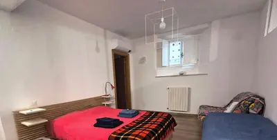 Letto o letti in una camera di B&B La Tana del Bianconiglio