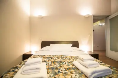 Letto o letti in una camera di Aurea Living Parma Family & Business Parcheggio