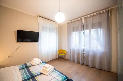 Letto o letti in una camera di Aurea Living Parma Family & Business Parcheggio