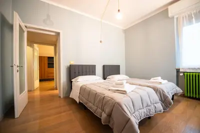 Letto o letti in una camera di Aurea Living Parma Family & Business Parcheggio