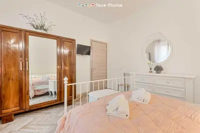 Letto o letti in una camera di La Corte dei ValEmi 2-3, TerreMarine