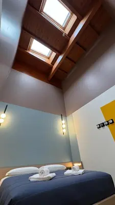 Letto o letti in una camera di HC Hotel Manerbio Loft