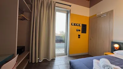 Letto o letti in una camera di HC Hotel Manerbio Loft