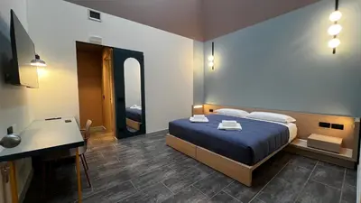 Letto o letti in una camera di HC Hotel Manerbio Loft
