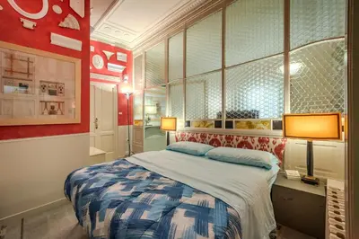 Letto o letti in una camera di Centro Assoluto, Parcheggio - Museo Privato