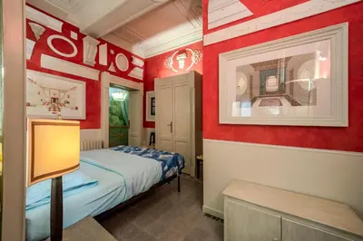 Letto o letti in una camera di Centro Assoluto, Parcheggio - Museo Privato