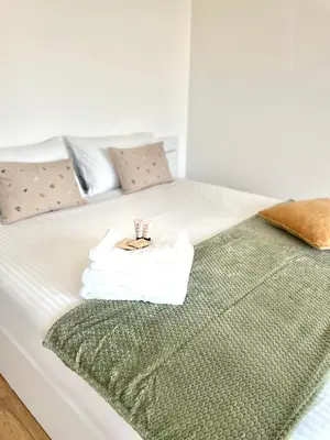Letto o letti in una camera di MiA MARiA MARGAUX