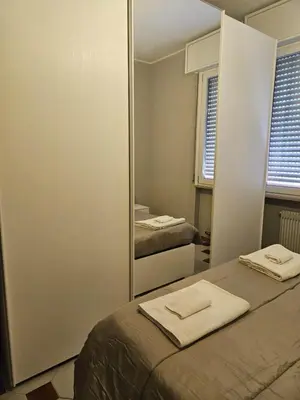 Letto o letti in una camera di Appartamento vicino lo stadio con garage