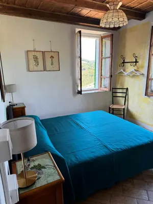 Letto o letti in una camera di Casa del Falco