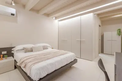 Letto o letti in una camera di Modena Historic Center - Elegant Family Apartment