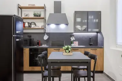 Cucina o angolo cottura di Stylish Loft with Private Garage near Ghirlandina