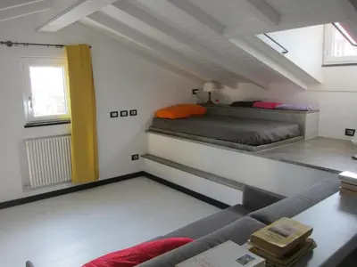 Letto o letti in una camera di Caruggio 49 Attico con parcheggio Sestri Levante