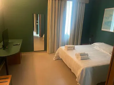 Letto o letti in una camera di GARDEN HOTEL - Praticello di Gattatico - Terre di Canossa
