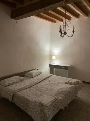 Letto o letti in una camera di Trilocale Inzani