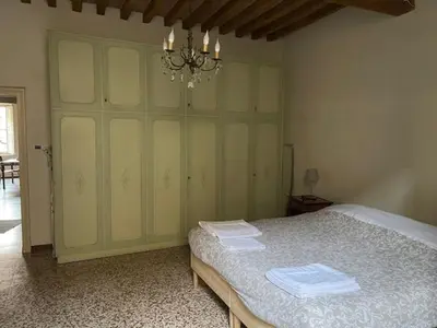 Letto o letti in una camera di Trilocale Inzani