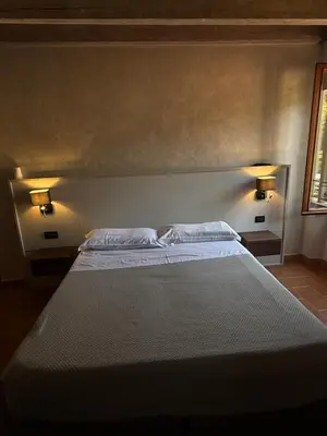 Letto o letti in una camera di Hotel La Valle