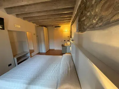 Letto o letti in una camera di Hotel La Valle
