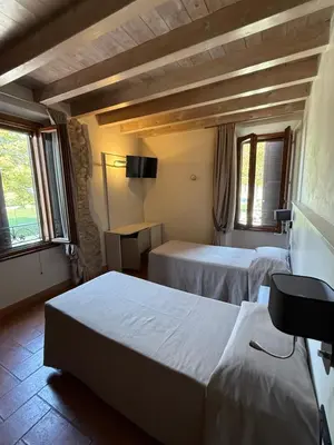 Letto o letti in una camera di Hotel La Valle