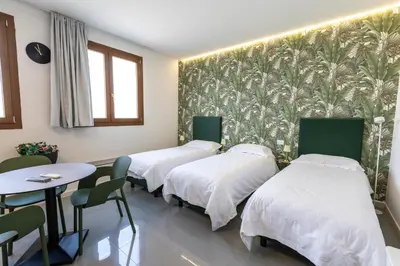 Letto o letti in una camera di Foresteria SMART ROOMS