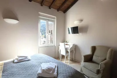 Letto o letti in una camera di Ricky Rooms