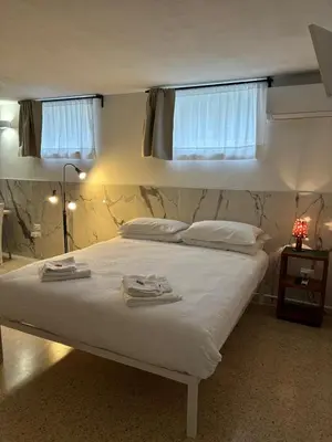 Letto o letti in una camera di da Melina