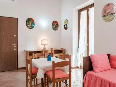 Area soggiorno di Apartment Wohnung mit Einzelbetten und Schlafsofa by Interhome
