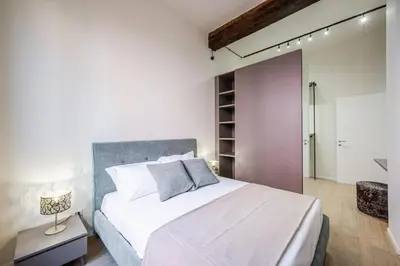 Letto o letti in una camera di L'Antico Moderno Boutique Apartment