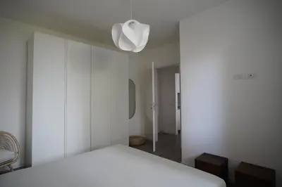 Letto o letti in una camera di Appartamento Corte dei magazzini