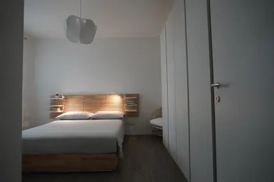 Letto o letti in una camera di Appartamento Corte dei magazzini