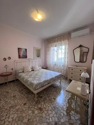 Letto o letti in una camera di Casa Pierina